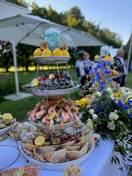 Elegant wedding catering setup in Ischia with decorated table, Mediterranean flowers and sea view
